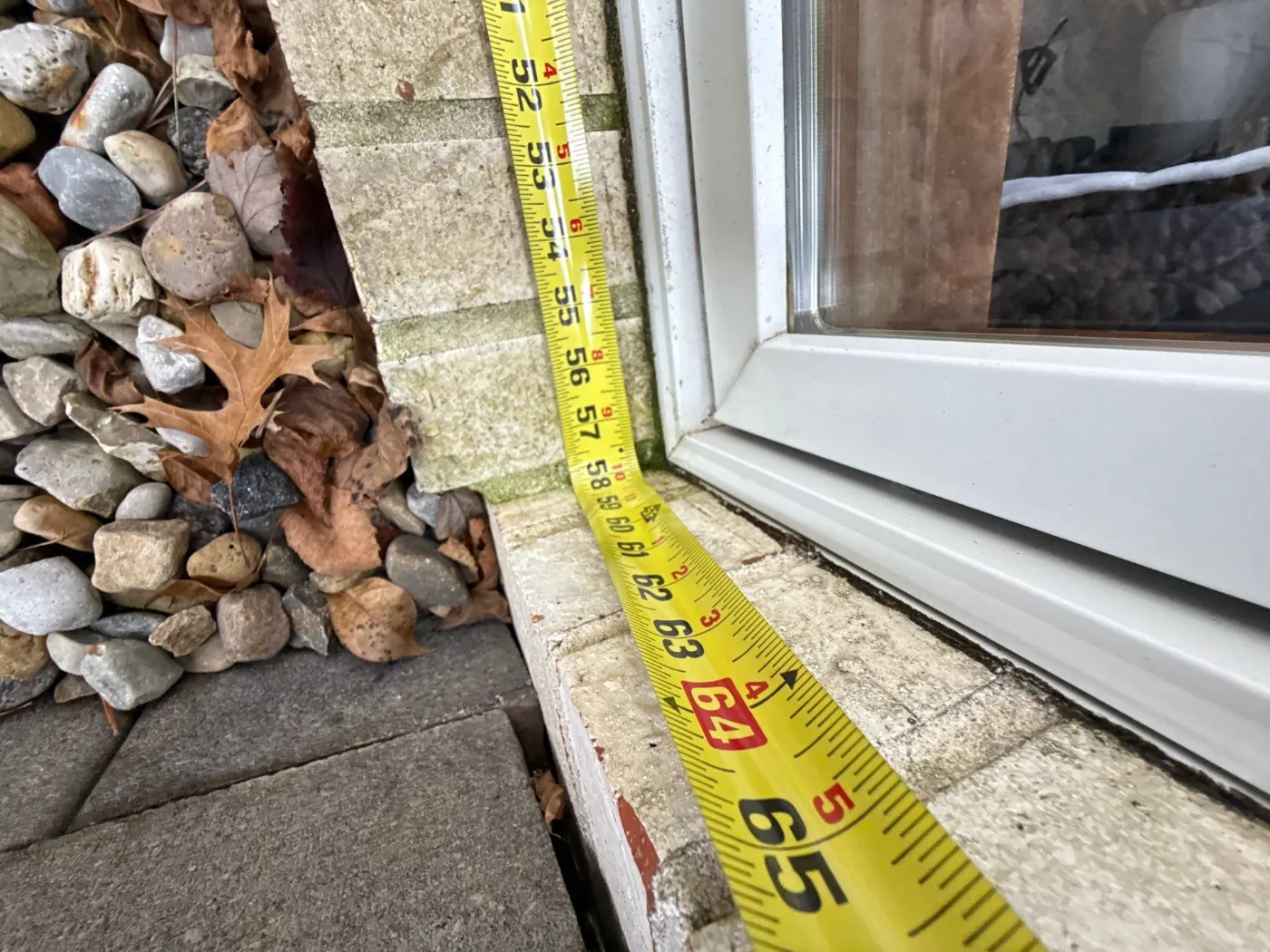Storm-damaged window documented in Chatham Hills